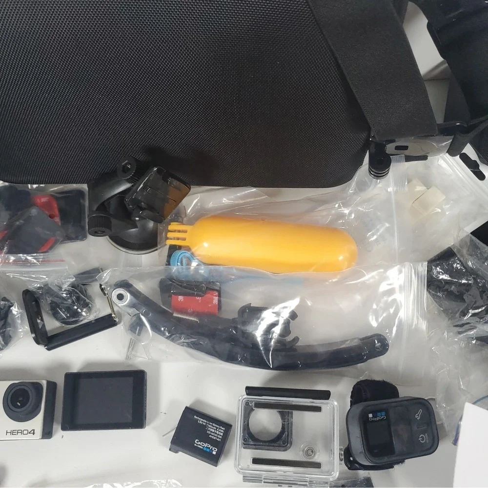 GoPro Hero4, Two Batteries, And Accessories Lot. Mounts, Body And Head Harness